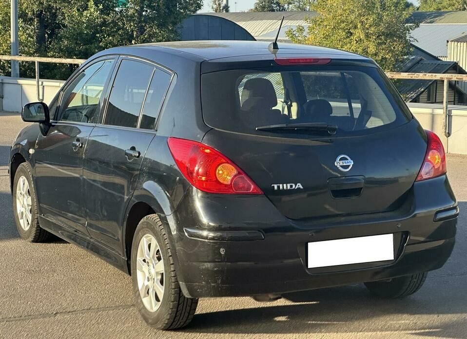 Nissan Tiida 1.6 AT (110 л.с.)