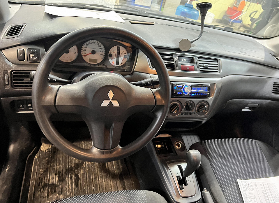 Mitsubishi Lancer, IX 1.6 AT (98 л.с.)