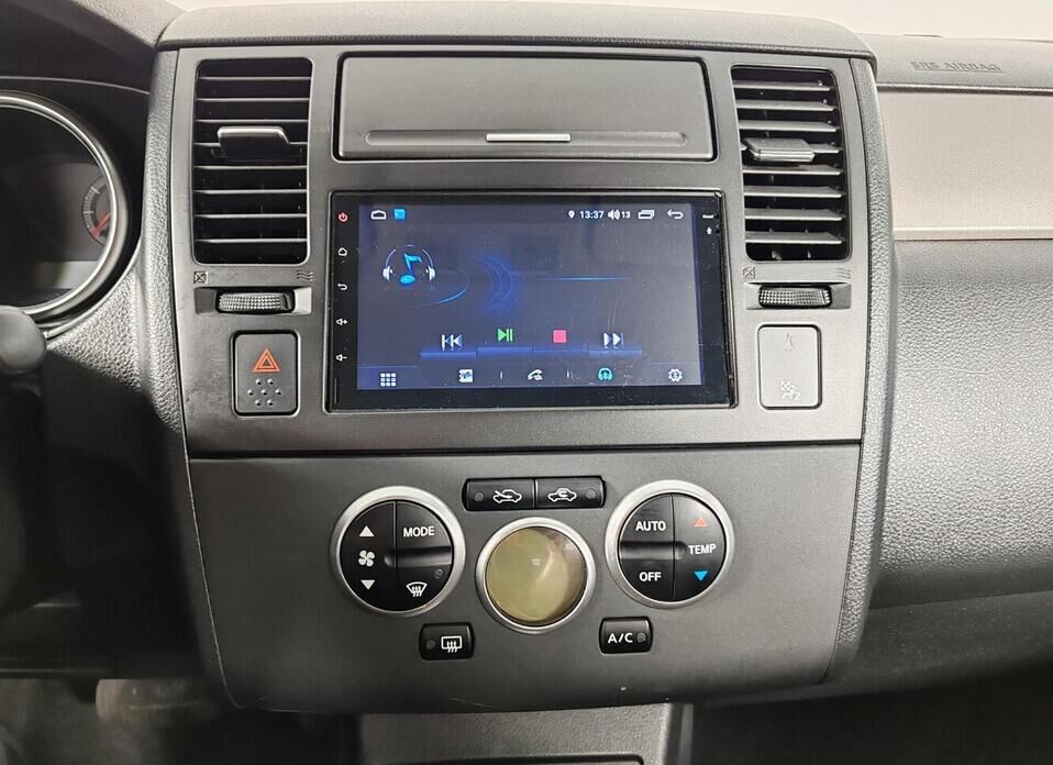 Nissan Tiida 1.6 AT (110 л.с.)