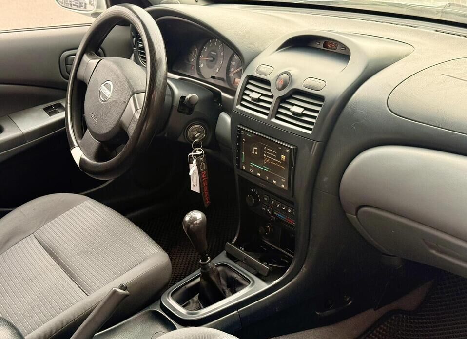 Nissan Almera Classic, I 1.6 MT (107 л.с.)