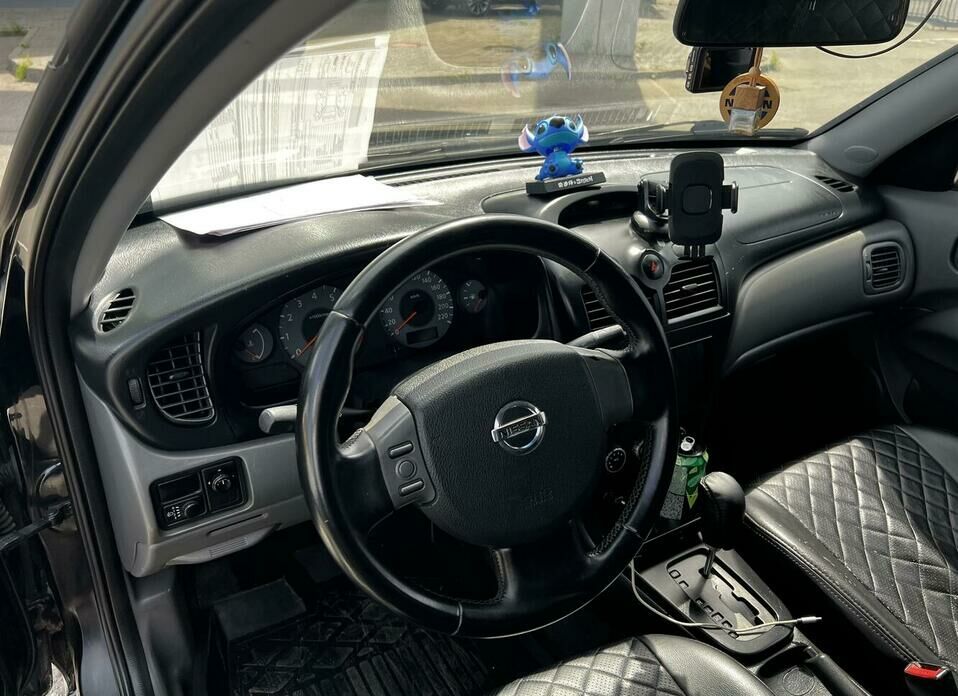 Nissan Almera Classic 1.6 AT (107 л.с.)