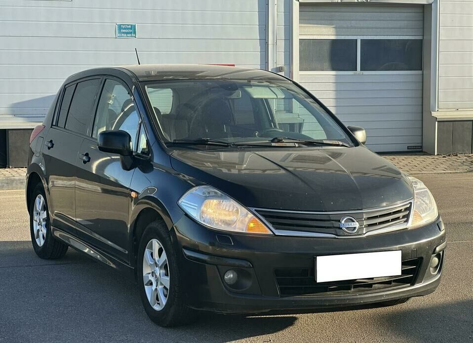 Nissan Tiida 1.6 AT (110 л.с.)