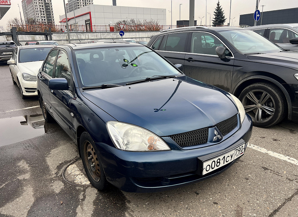 Mitsubishi Lancer, IX 1.6 AT (98 л.с.)
